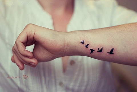 Flying Bird Silhouette Tattoo
