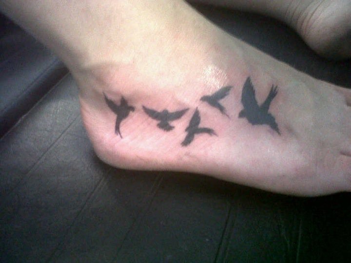 Flying Bird Silhouette Tattoo